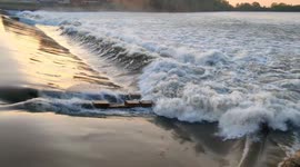 soothing water flowing over a dam