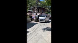 Minivan driver tackles wavy road in the Philippines