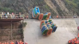 Hundreds of waterpark visitors wait for just a few rafts at lake in China