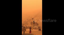 Apocalyptic scenes in China as severe sandstorm masks sky with orange haze - thousands of tourists evacuated