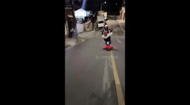 Bike loses balance and hits parked car on downhill road in Brazil