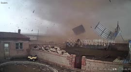 Incredible instinct: Sheep flock huddles together moments before tornado rips roof off pen in China