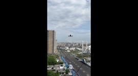 Drone warns woman filming military parade from window in Astana, Kazakhstan