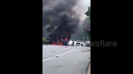 Fearless man pries open burning car door with bare hands to rescue trapped driver