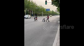 Bizarre clip shows 'robot' pushing baby stroller across road in China