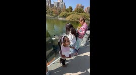 Daughter accidentally throws phone into water while feeding fish in Chile
