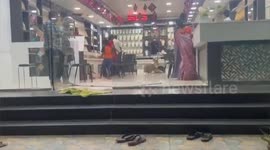 Customers shoked in jewellery shop as stunned a Deer scampers suddenly inter