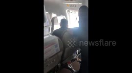 Passenger arrested after opening emergency exit as plane landed in southern China