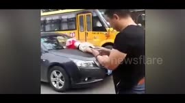 Woman throws herself onto cars to try to claim money