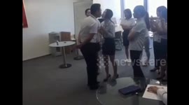 Male leader kisses female staff one-by-one on team construction activity