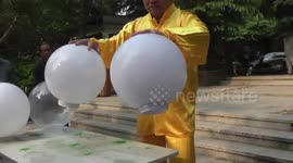 Kung fu master uses only his palms to lift objects
