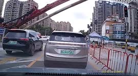 Workers escape by inches as drilling rig collapses onto road in China