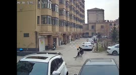 Chinese policeman achieves hero status after pulling boy out of way of oncoming motorcycle