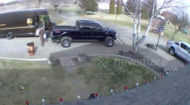 Delivery driver flees to safety as customer's dog gives him a not-so-warm welcome