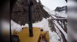 US: Cliffside Snowplow Inches Along Glacier Ravine In Heart-Stopping Video
