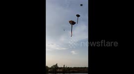 Man hoisted into sky by giant kite in life-risking stunt