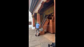 Unexpected bond—Monk and tourist share a playful moment at Rinpung Dzong
