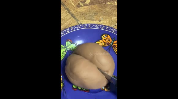 Manipulating putty or clay squishy and cutting through it, pulling, shaping it