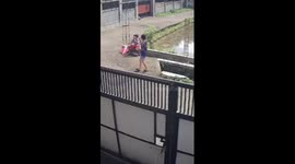 Child falls into ditch while flying kite in Lombok, Indonesia