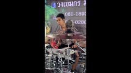 Pigeon sits on drum cymbals during outdoor concert