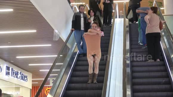 Girl takes off her dress on an escalator (unedited prank)
