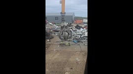 Scooters and bike get playful ride from material handler before disposal