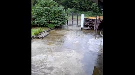 Rainy day adventure takes a comical turn as young boy slips and falls twice in a row