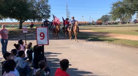 Children at Roberts Road Elementary school in Hockley, Texas watch the he 68th annual Prairie View Trail Ride Association’s (PVTRA) Annual Trail Ride for the Houston Livestock Show