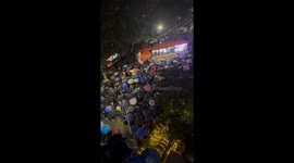 Fans gather in the rain for pop concert in the Philippines