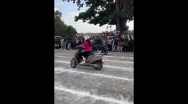 Woman wins slow motorcycle balancing contest in Sindhuli, Nepal