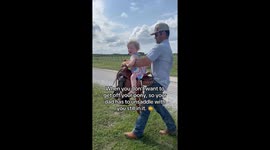 An almost 2 year old girl is sad to have to get off her pony!