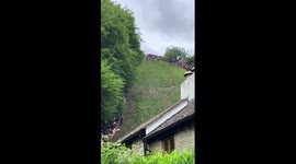 Spectacular tumbles at Cooper's Hill Cheese-Rolling event in England, UK
