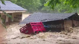 Torrential floods sweep through villages in Yunnan, China
