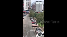 Cars topple one by one after section of road gradually collapses in China