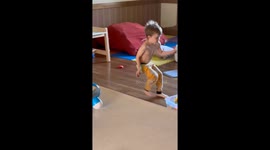 A child is seen teasing and tormenting a dog in a playful manner. The dog, appearing to have had enough, suddenly charges at the child, knocking them over. The video captures the dog's swift reaction, highlighting the importance of respecting animals' bou