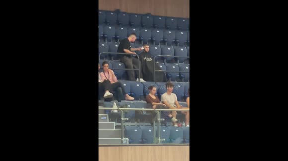During The Semi-Finals of The Basketball Championship in Bulgaria You Can See a Guy on The Stands Getting a Haircut