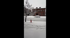 'Snowstorm Dominoes' - Car collision causes light pole chaos