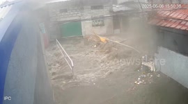 Flood swamps bridge during downpours in the Philippines