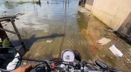 One Man’s Ride Through a Flooded Road in Bulacan, Philippines