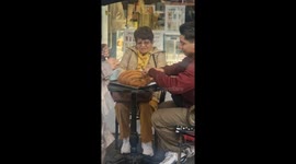 Cafe customers enjoy oversized XXL croissant in London