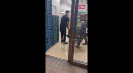 Staff remove drunk local from supermarket in Japan