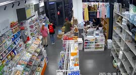 Wind rattles through shop when staff tries to close the door during storm