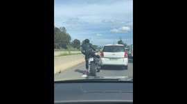 Motorcyclist Gives a Flower