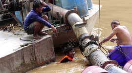 Pipe leaks during a pumping operation on the River Ping in Chiang Mai, Thailand