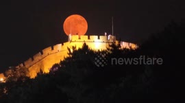 China: 'Lowest full moon' graces sky over China's landmarks