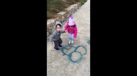 Kids Innocently Guess at a Graffitied Penis on the Ground