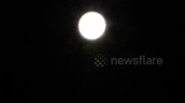 FULL MOON with Starnge Red Dot in the Sky