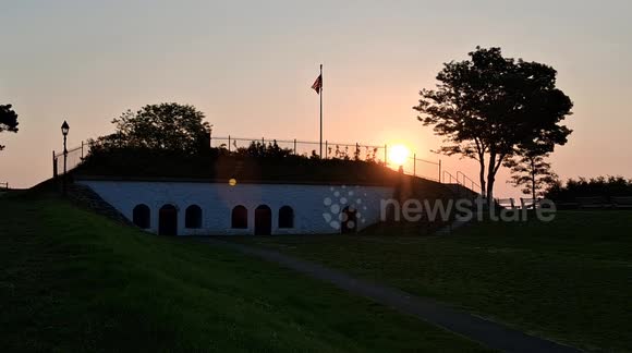 Fort Sewall in Marblehead, Massachusetts at sunrise with walkers