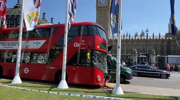 A double-decker bus crashes in Parliament Square in London