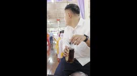 Temptation! Hilarious moment cruel friend teases Buddhist monk with whiskey